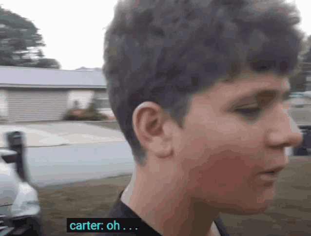 a close up of a person 's face with the words carter oh on the bottom right