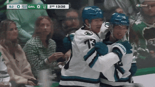 a hockey game is being played between the sharks and the dallas cowboys