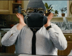 a man is wearing a gas mask and goggles