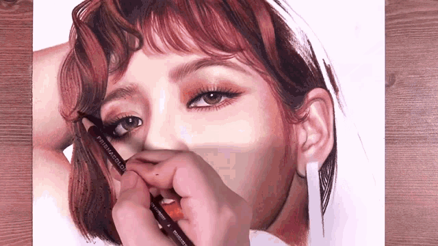a close up of a person drawing a woman 's face with a pencil that says prismacolor