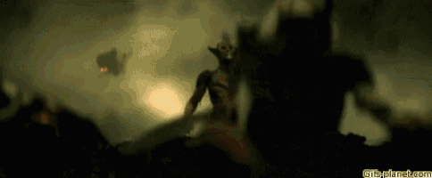 a blurred image of a man fighting a monster in a dark forest .