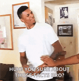 a man in a white shirt is standing next to a woman in a living room and talking to her .