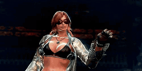 a woman wearing sunglasses and a bra is standing in a dark room