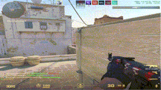 a person is holding a gun in front of a building with the number 30 on the screen