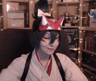 a woman wearing a mask with a fox ear on it