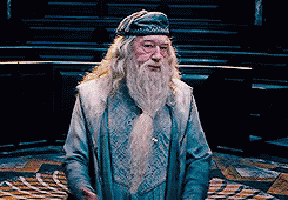 a man with a beard wearing a blue hat and a blue coat