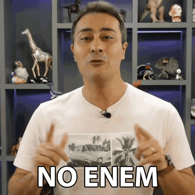 a man wearing a white shirt that says " no enem "
