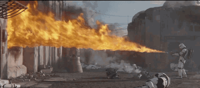 a storm trooper is holding a flamethrower in his hand