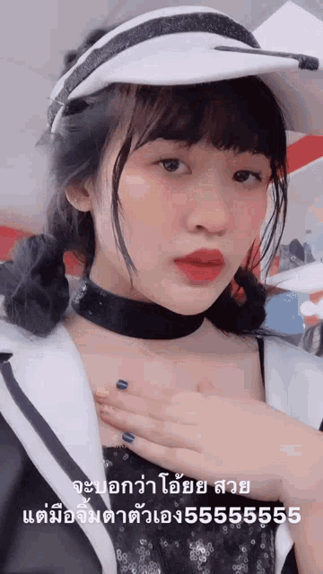 a girl wearing a white hat and a black choker has the number 555555 written on her chest