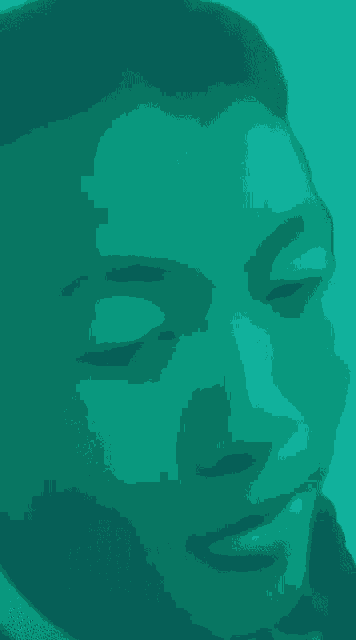 a close up of a man 's face with purple background