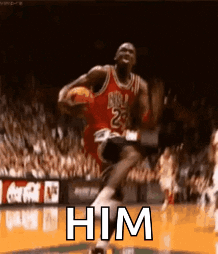 a basketball player is jumping in the air while holding a basketball in his hands .