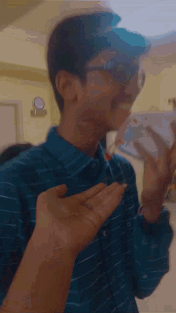 a blurry picture of a man wearing glasses
