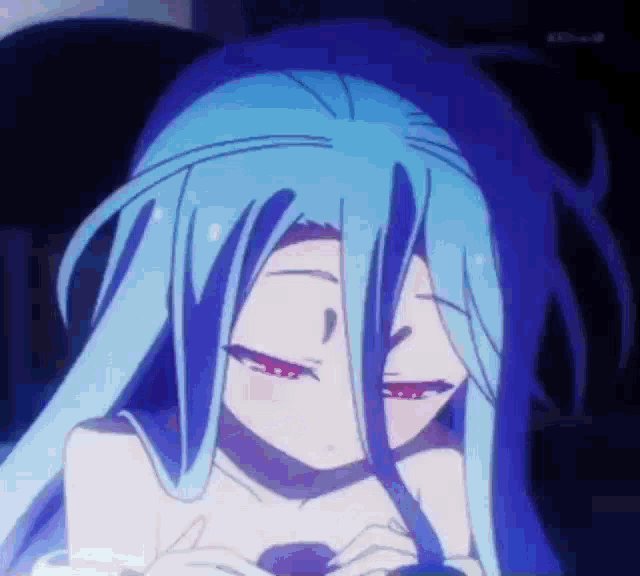 a girl with long blue hair and red eyes is looking down .