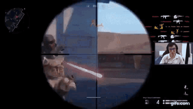 a man is playing a video game while looking through a scope