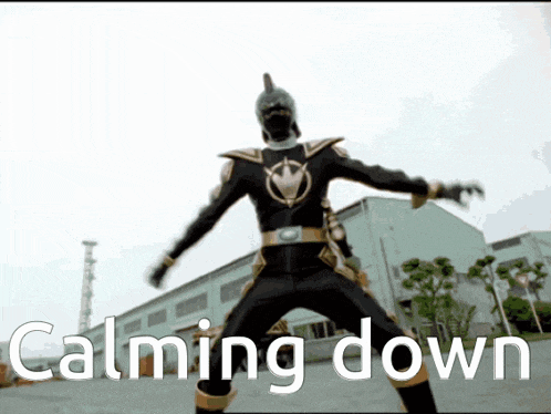 a man in a black and gold costume is standing in front of a building with the words calming down below him