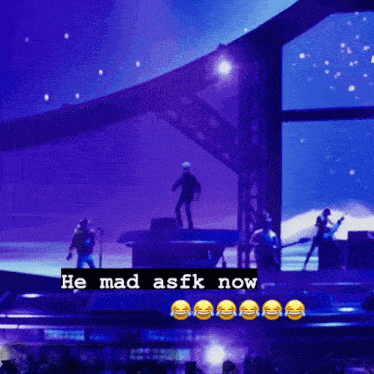 a group of people on a stage with the words he mad asfk now below them