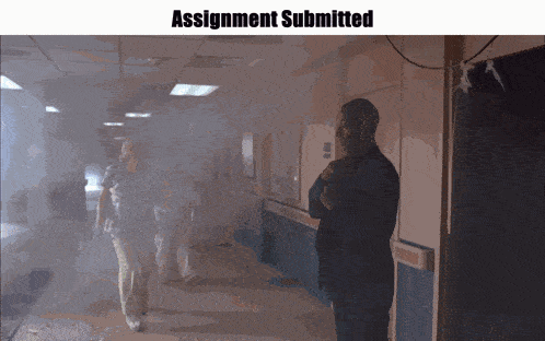 a man in a suit stands in a hallway with the words assignment submitted on the bottom