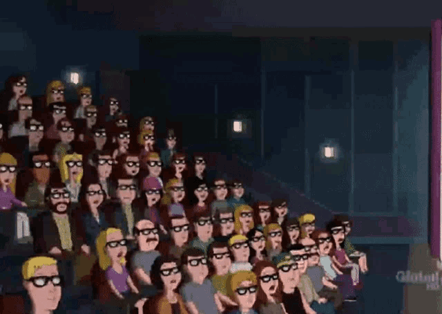 a crowd of people wearing 3d glasses are sitting in a theater