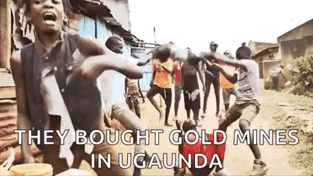 a group of people are dancing on a street in a video .