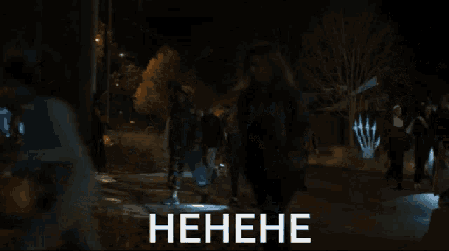 a group of people are walking down a street and the word hene is on the bottom right