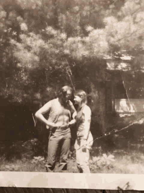 a black and white photo of a man and a woman