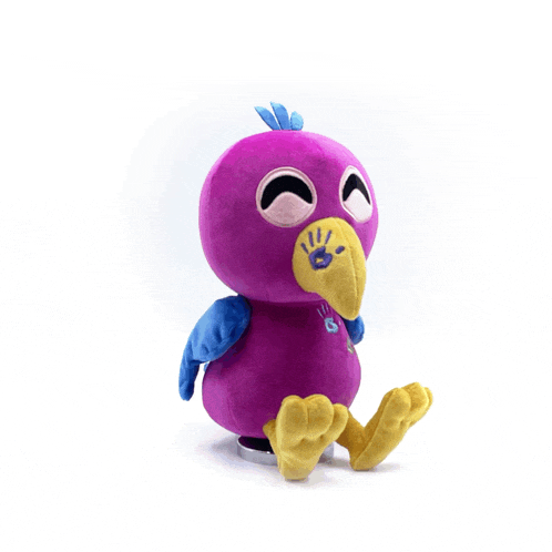 a purple stuffed animal with a yellow beak and blue feathers is sitting on a white surface