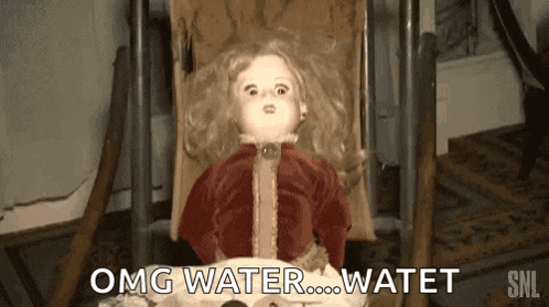 a creepy doll is sitting in a chair and says omg water watet .