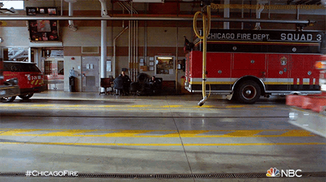 a chicago fire department squad 3 fire truck in a garage