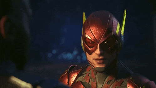 a man in a red superhero costume looks at another man