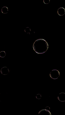 a bunch of soap bubbles are floating in the air