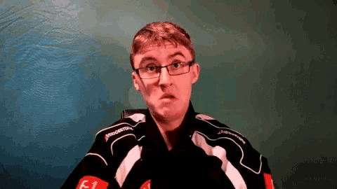 a man wearing glasses and a black jacket that says bridgestone