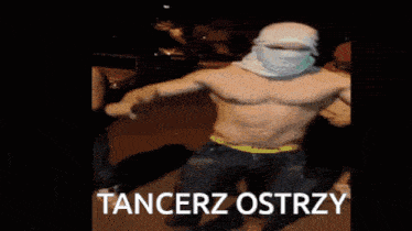 a shirtless man with a bandana on his head holds a sword with the words tancerz ostrzy below him
