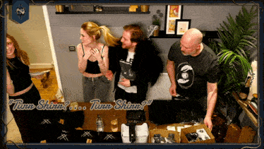 a group of people standing in a room with the words turn shine on the bottom right