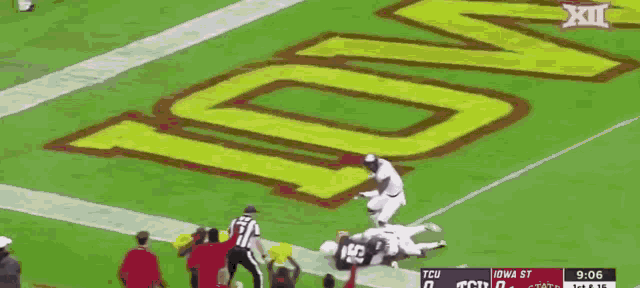 a football game is being played between iowa state and texas tech