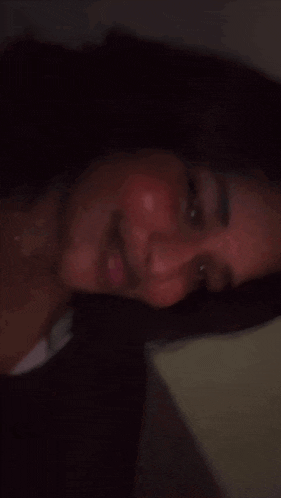 a close up of a woman 's face with a smile on her face