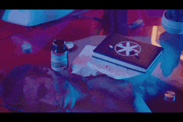 a bottle of xanax sits next to a book with a cross on it