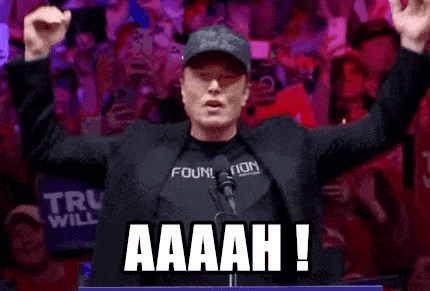 a man is standing in front of a crowd with his arms in the air and says aaaah !