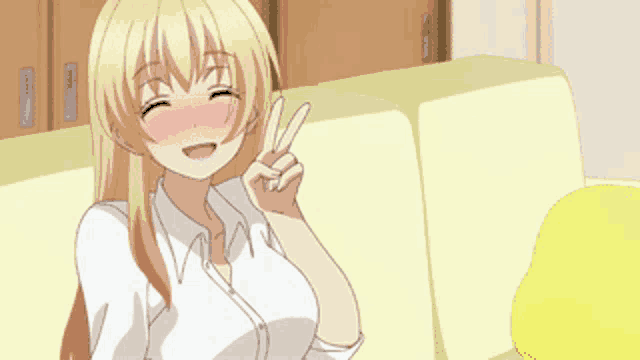 a blonde anime girl sitting on a couch giving the peace sign