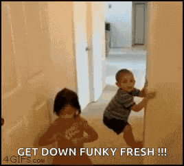 a boy and a girl are playing in a hallway with the words get down funky fresh .