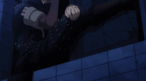 a man with white hair and black pants is laying on the ground