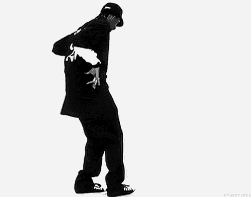 a man in a black jersey with the number 20 on it is walking .