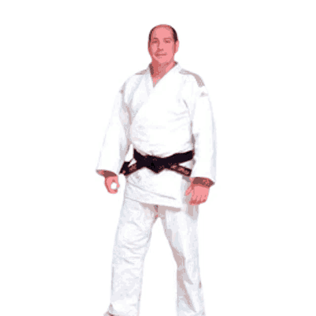 a man in a white karate uniform has a black belt