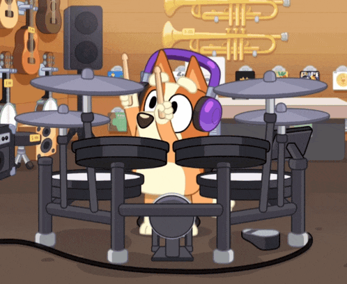 a dog wearing headphones is playing drums