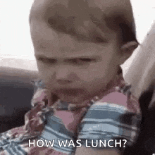 a baby is crying while sitting in a car seat .
