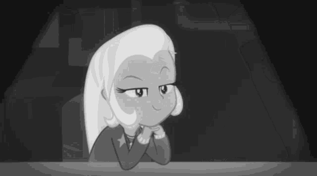 a black and white photo of a cartoon character sitting at a table .