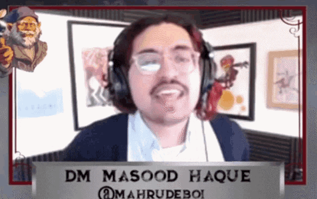 a man wearing headphones and a name tag that says dm masood haque on it