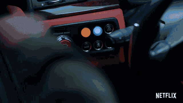 a person pressing a button that says predator mode
