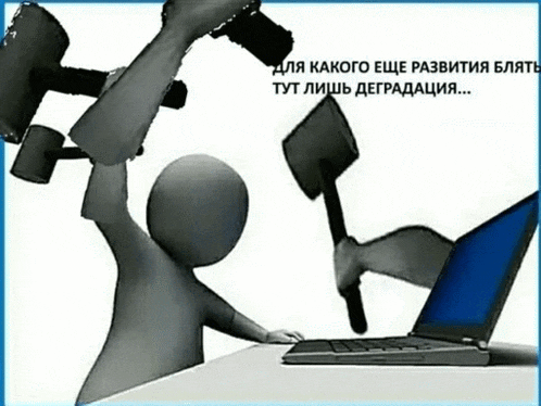 a person is holding a hammer in front of a laptop computer