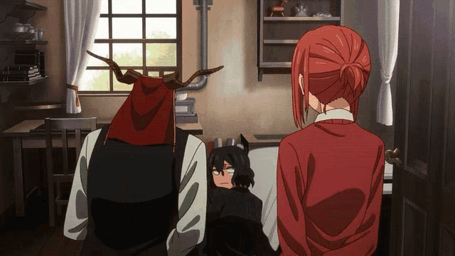 a man with antlers on his head and a woman with red hair are standing in a room