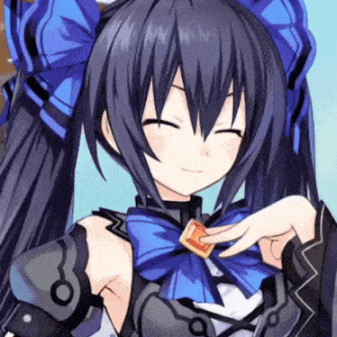 a girl with black hair and a blue bow on her head is smiling